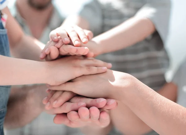 Hands of the family are stacked together — Stock Photo, Image