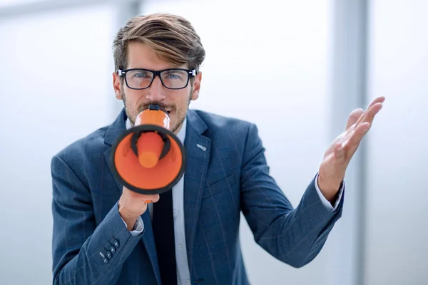 man screaming on megaphone over white background