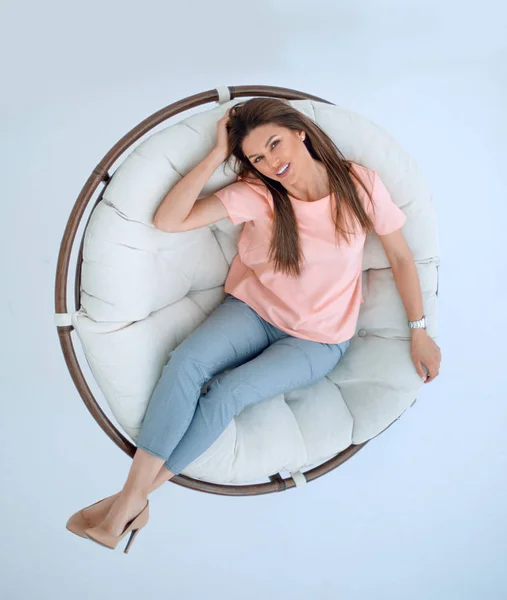 Top view.young woman relaxing in a comfortable chair — Stock Photo, Image