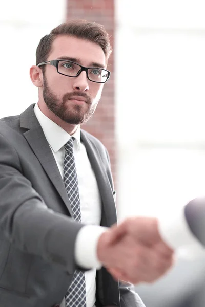 Businessman shaking hands in office — Stock Photo, Image