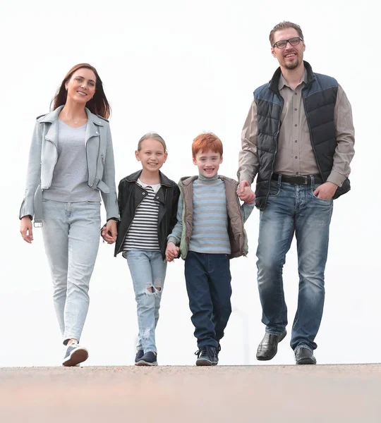 in full growth.young family with their children walking togethe