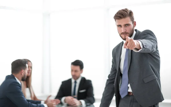 Serious businessman standing in the office and pointing at you — Stock Photo, Image