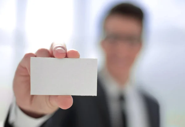 Close up .business card in the hands of a businessman . — стоковое фото