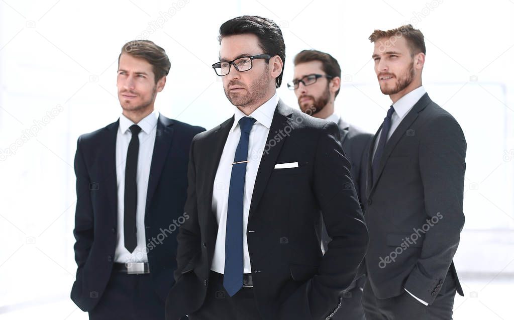 businessman and his business team standing in the office
