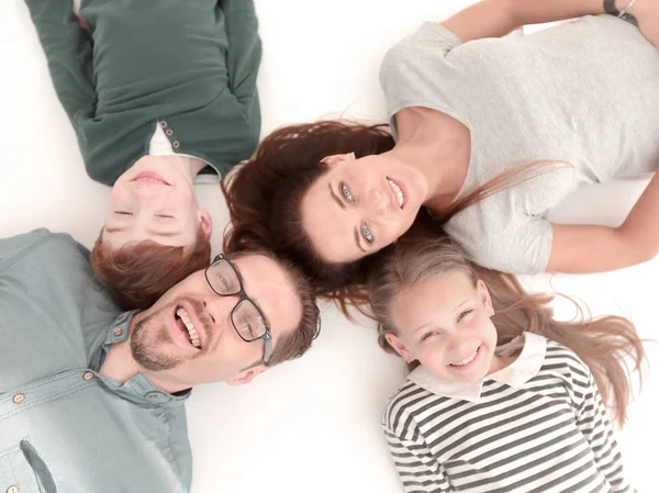 Pohled shora. šťastná rodina, ležící na podlaze — Stock fotografie