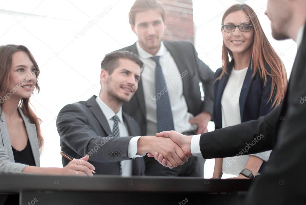 Handshake between employees after the meeting