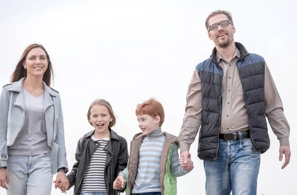 Happy parents with their children holding each others hands — Stock Photo, Image