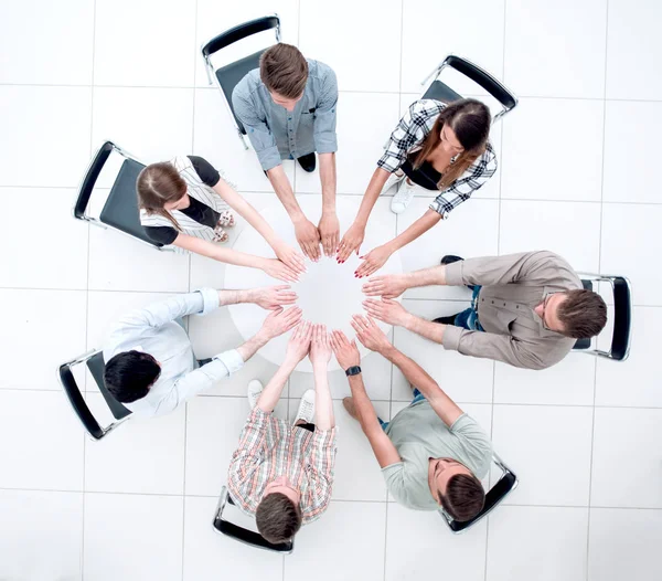 Top view.successful equipo de negocios sentado en la mesa redonda —  Fotos de Stock