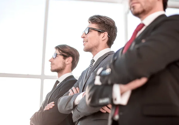 Side view of a group of confident businessmen looking at a copy space — Stock Photo, Image