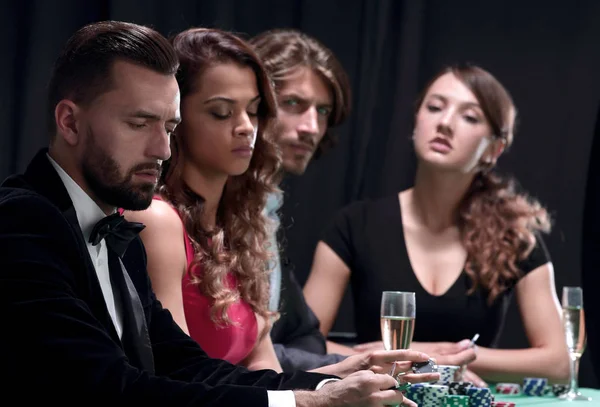 Side view of group of people playing poker together in casino — Stock Photo, Image