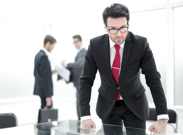 Strict businessman standing in the conference room — Stock Photo, Image