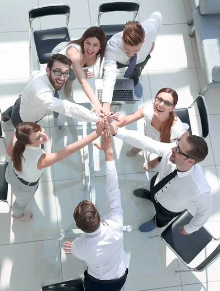 Top view.the companys employees are giving each other high five — Stock Photo, Image