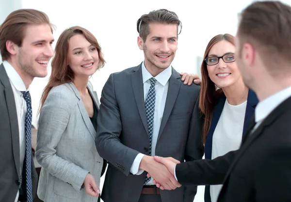 Handshake in the lobby of an office building — Stock Photo, Image