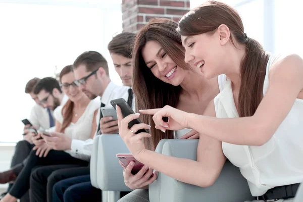 Young employees of the company using their gadgets — Stock Photo, Image