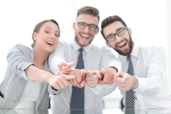 Close up.a smiling business team pointing at you — Stock Photo, Image