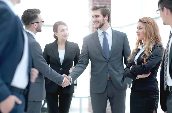 Welcome handshake of businessmen in the office — Stock Photo, Image