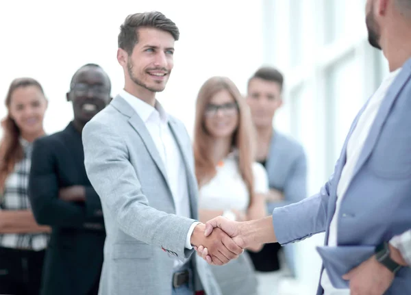 Smiling male boss promoting rewarding handshaking — Stock Photo, Image
