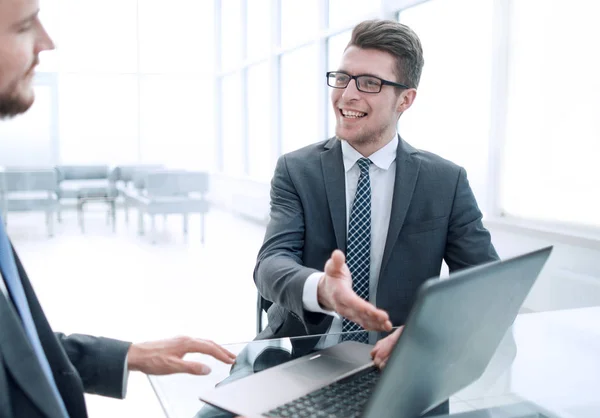 Close up .business partners discuss information sitting at the office table — стоковое фото