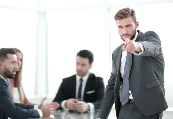 Serious businessman standing in the office and pointing at you — Stock Photo, Image