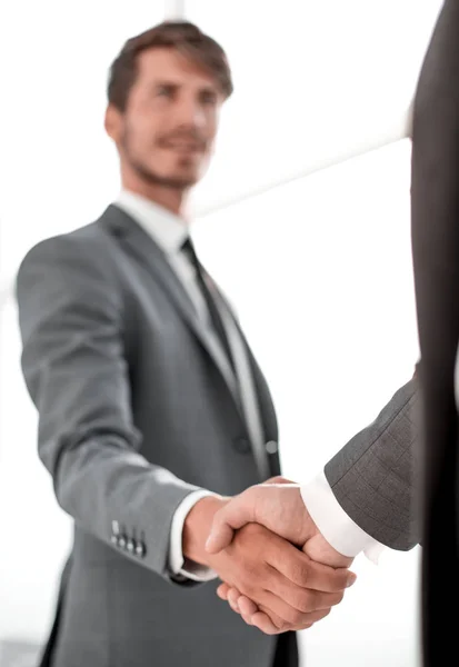 Happy businessman making handshake with businesswoman at meeting — Stock Photo, Image