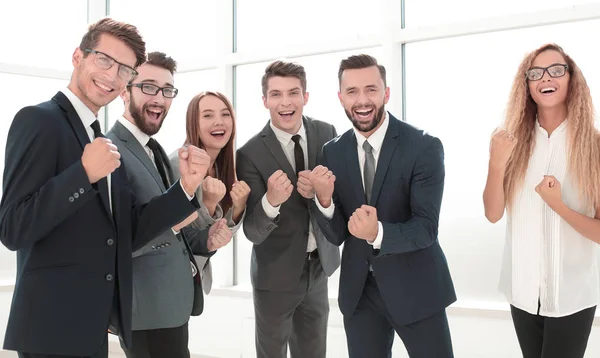 Happy business team standing in office. — Stock Photo, Image