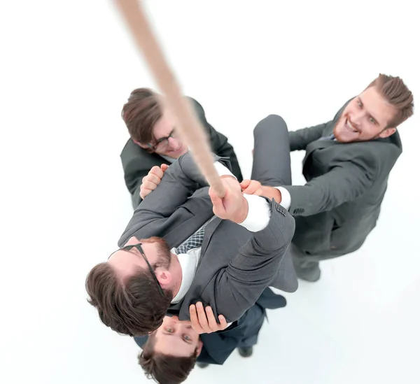 Top view .business equipo ayuda al jefe a subir . —  Fotos de Stock