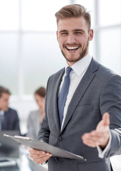 close up.friendly businessman standing in his office