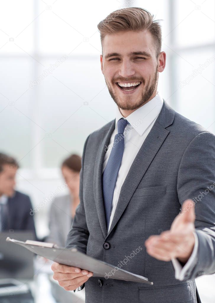 close up.friendly businessman standing in his office