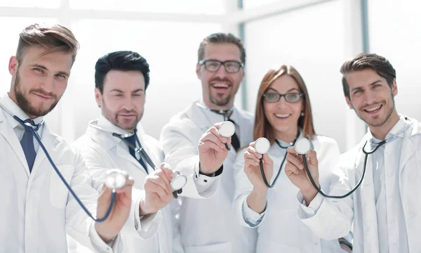 stock image group of doctors hold their stethoscopes