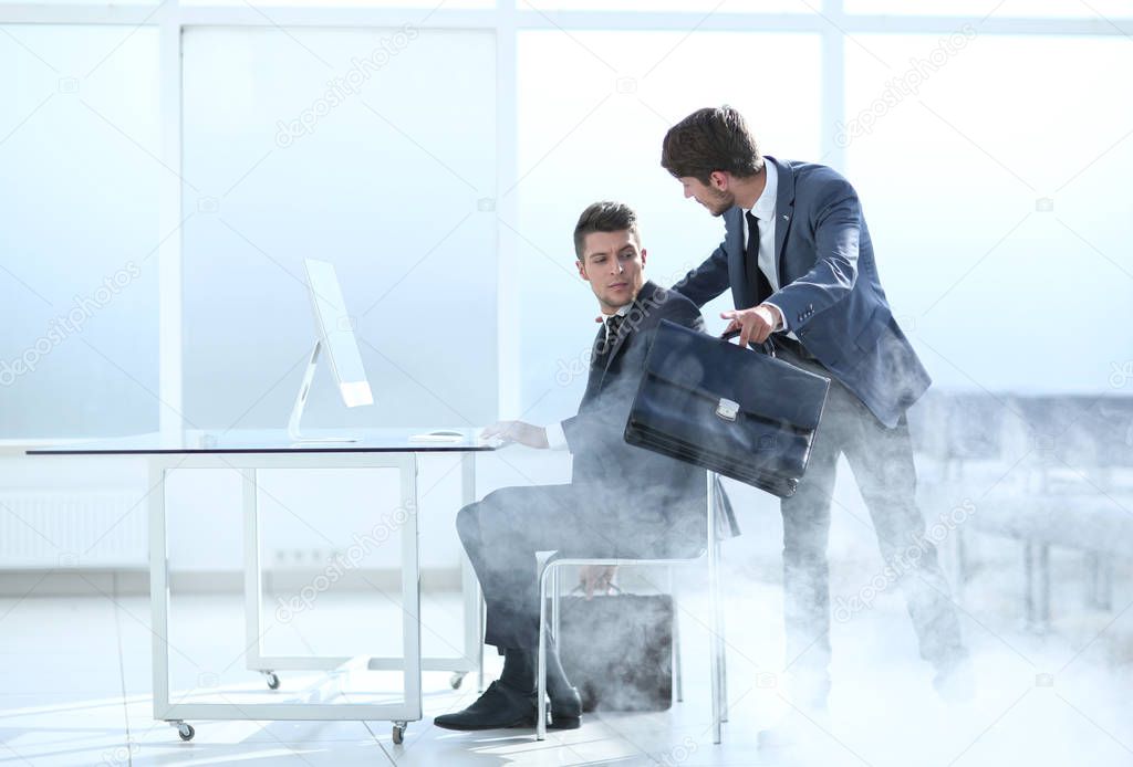 two businessmen during the beginning of the fire