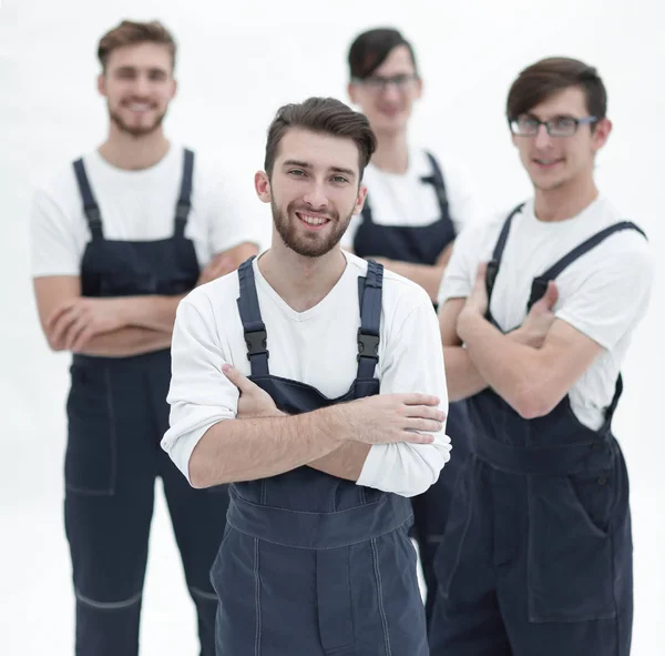 Happy team of responsible movers and their smiling leader. — Stock Photo, Image