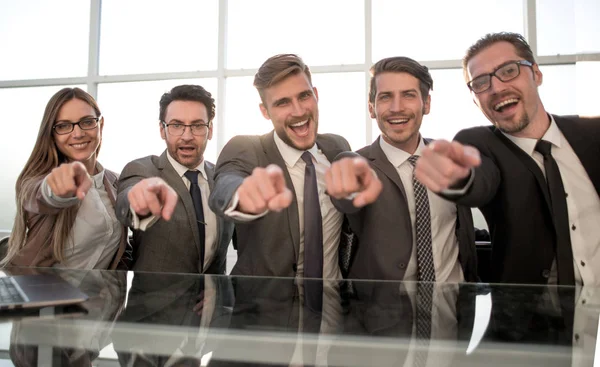 Businessmen in their office pointing to the front — Stock Photo, Image