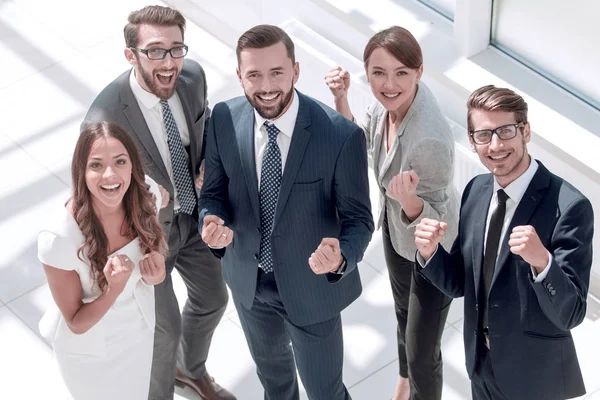 Top view.happy business team showing their success — Stock Photo, Image
