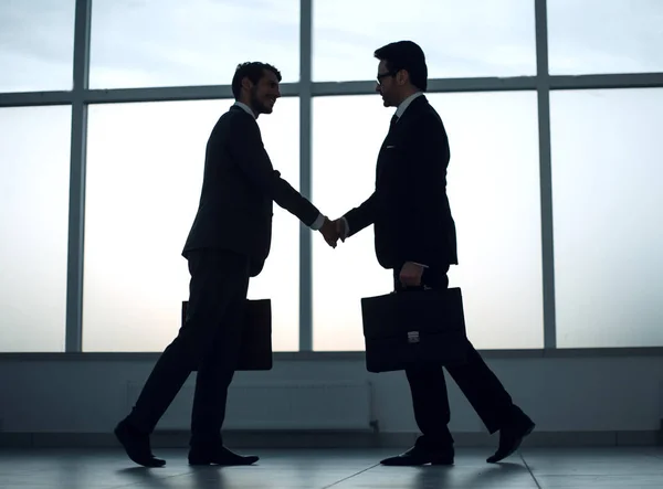 Two business people holding out their hands for a handshake — Stock Photo, Image