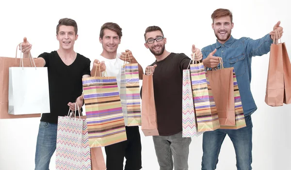 Papieren tassen in de handen van een team van vrienden — Stockfoto