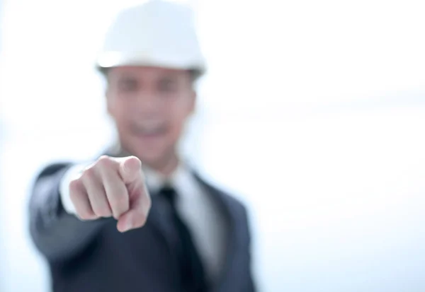Confident engineer in helmet points finger at camera — Stock Photo, Image