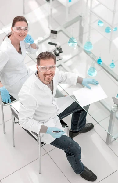 Top view.scientists at the laboratory table. — Stock Photo, Image