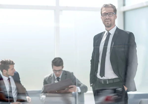 Responsible businessman standing in the office — Stock Photo, Image