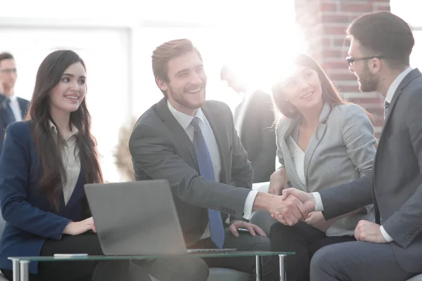 Successful partnership in business displayed by shaking hands in — Stock Photo, Image
