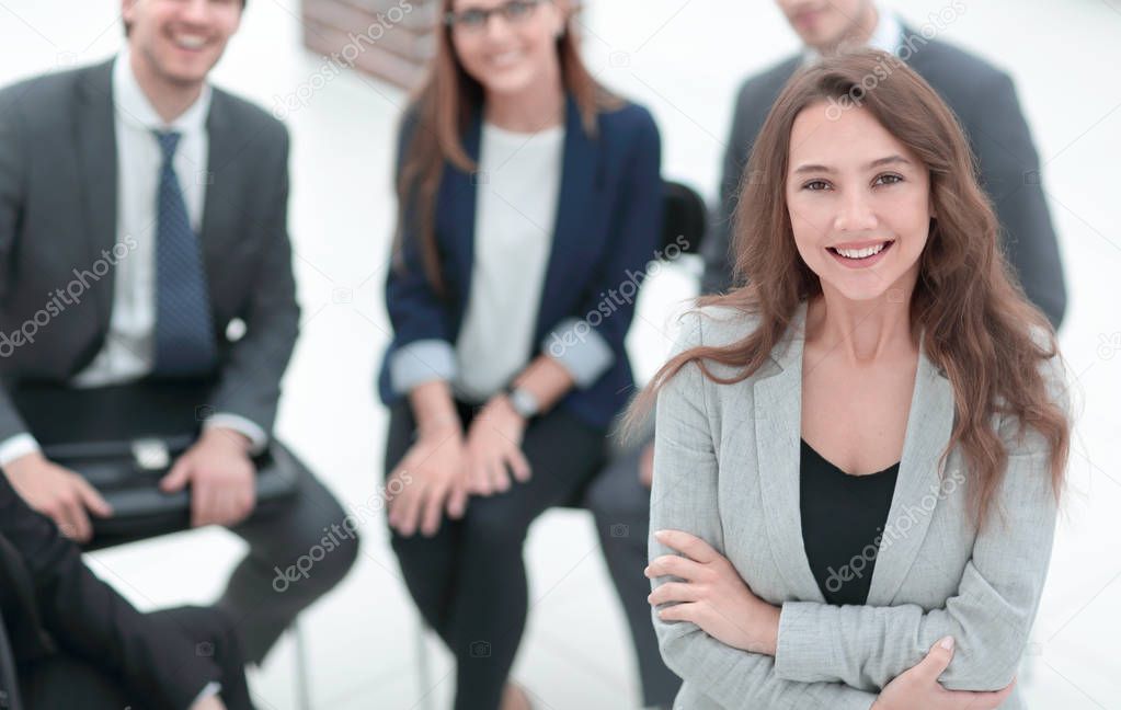 young woman at a business meeting with colleagues.