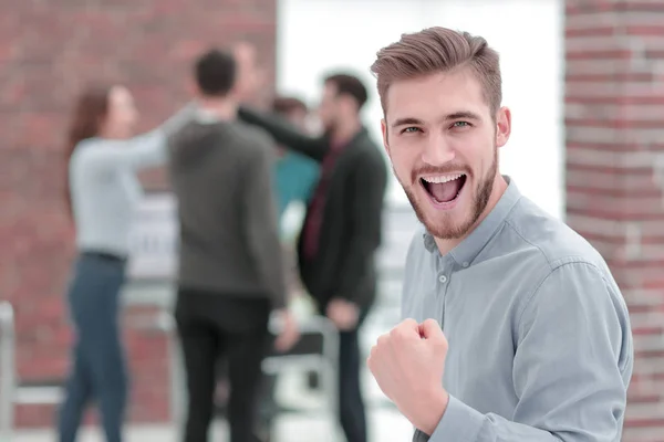 Handsome  businessman celebrating victory shouting happily in th — Stock Photo, Image