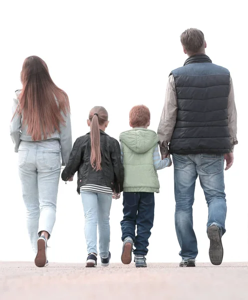 Rear view.happy family walking together. — Stock Photo, Image