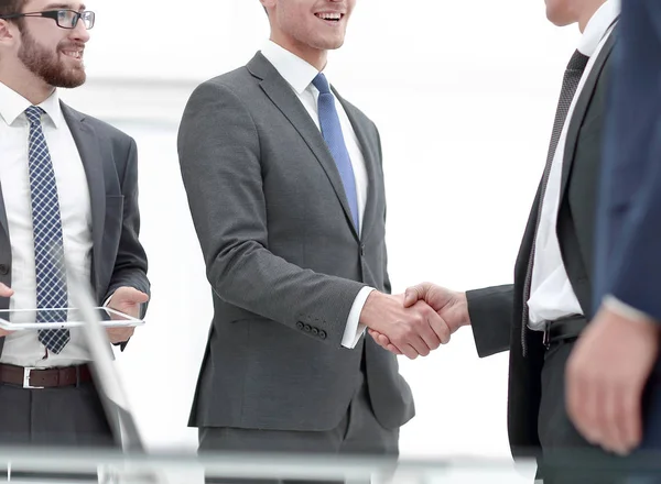 Business associates shaking hands in office — Stock Photo, Image