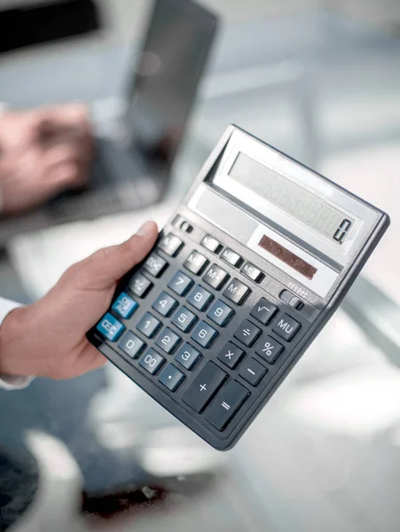 Businessman with calculator Stock Image