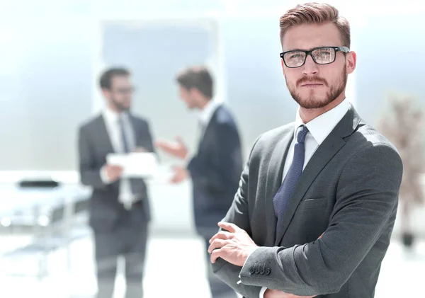 Confident businessman against the background of a modern office — Stock Photo, Image