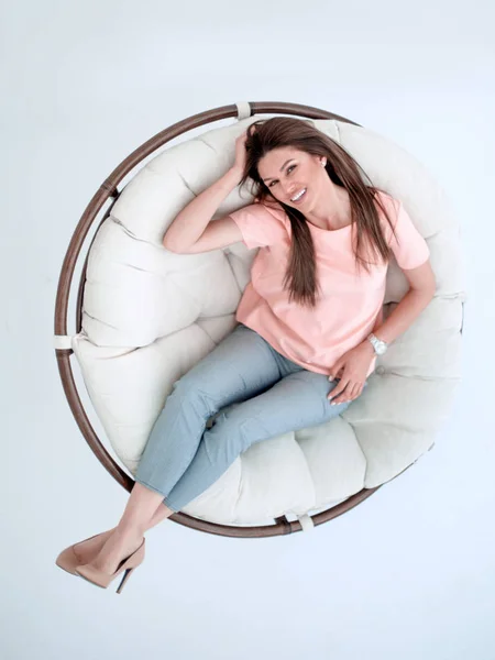 Top view.young woman relaxing in a comfortable chair — Stock Photo, Image