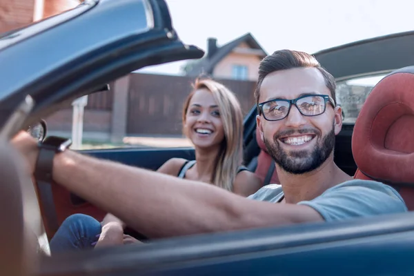 Close up .young family travelling in convertible — стоковое фото