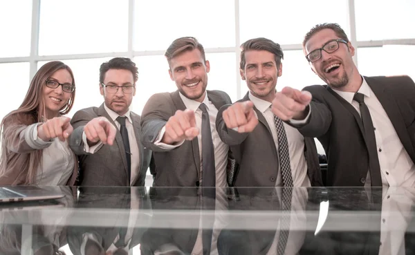 Businessmen in their office pointing to the front — Stock Photo, Image