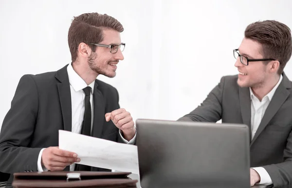 Close up .two business men discussing a business document — стоковое фото