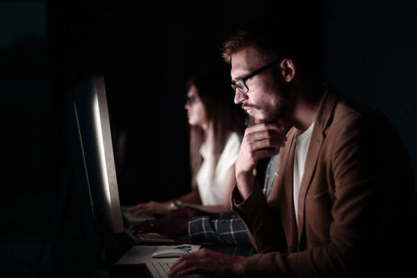 serious programmer looking at the computer screen